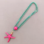 collar largo estrella mar fucsia